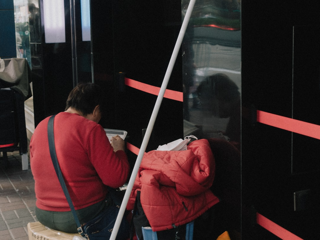 Painter applying fresh coat on a commercial building